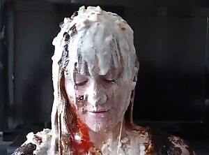 Pretty wife covered in food by her husband