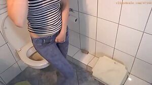 Wetting her jeans by the toilet