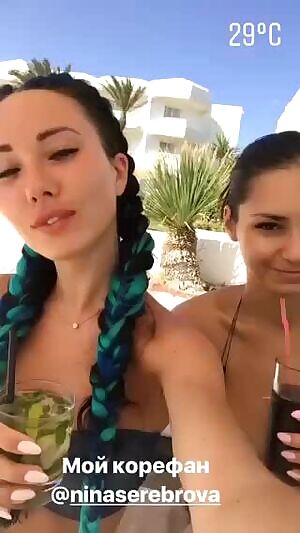 With Nina, wearing the tiniest bikini top in the world