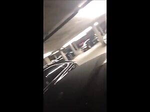Katrina Jade getting her ass pissed on in a parking garage, then she starts pissing on the ground, then the guy cups his hand and slaps her ass with her piss