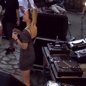 DJ dancing behind the decks