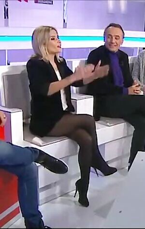 Thigh flashing in black pantyhose