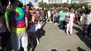 Grabbing Mr. Smiles at San Francisco Pride