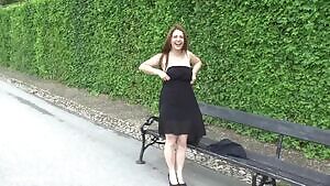 Shy girl goes for a stroll in a crowded park