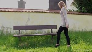 Luca Bella pissing from a bench