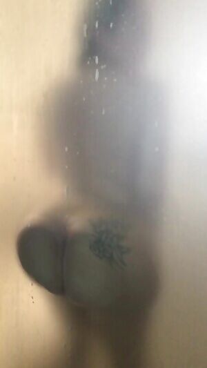 Her Big Booty against the glass