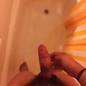 Behind the shower curtain