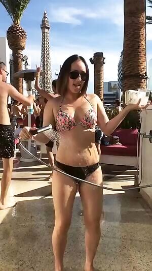 spraying herself with water