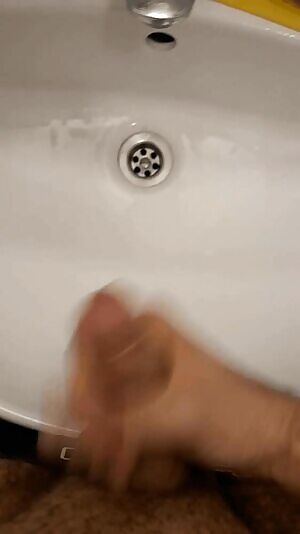 Cumming in bathroom sink