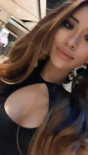 Sexy Malaysian babe showing some cleavage.