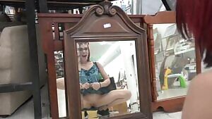 Trinity May suction cup dildo on the dressing room mirror