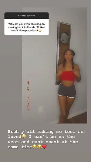 My 19 year old cousin in a red top & gray booty shorts