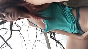 Redhead fingers herself in a tree during nature walk