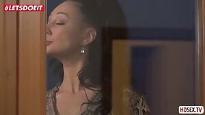 Mature nurse with long hair rides on young penis lover