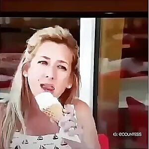 Licking her delicious ice cream cone