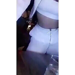 Bended over touching her boob