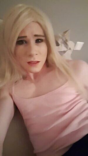 Playing around with a dildo on bed