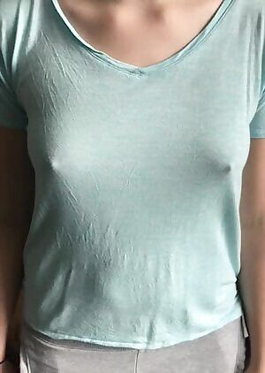 Bouncing her small tits around under her shirt