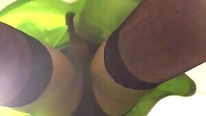 Jacking off in a green mini skirt