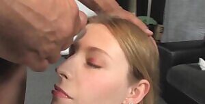 A thick waterfall of cum running down her face