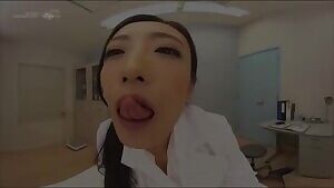 Miss Kano examines a student