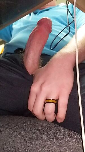 Cumming under the desk at work