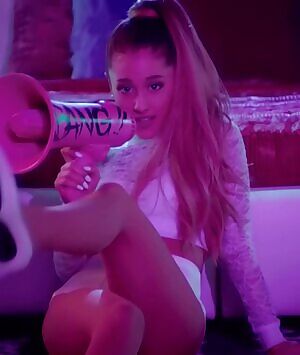 Ariana Grande crossing her legs