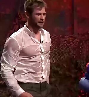 Chris Hemsworth sprayed with water