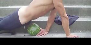 hot guy fucks a watermelon in public