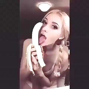 Braided blonde licking banana