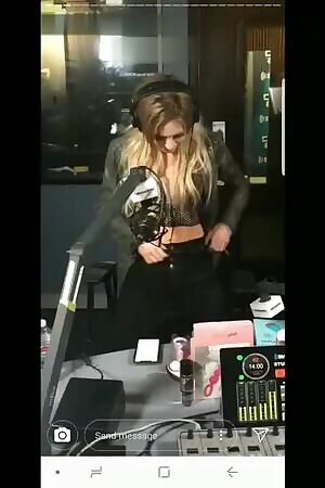 Girl testing sex toys vibrations on radio