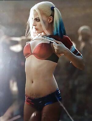 Margot Robbie pulling up her shirt for us to ejaculate on her body