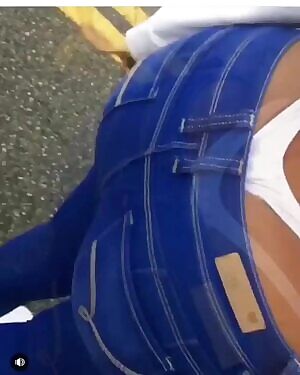 showing off her big ass in a thong