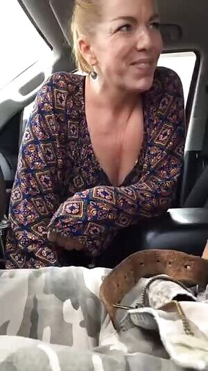 Auntie giving a blowjob on the car