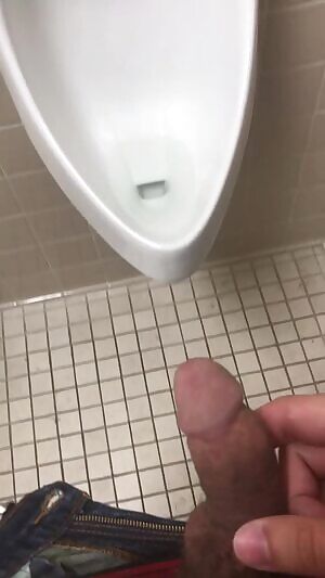 piss in a urinal from a distance