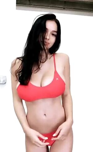 Help me find this busty brunette