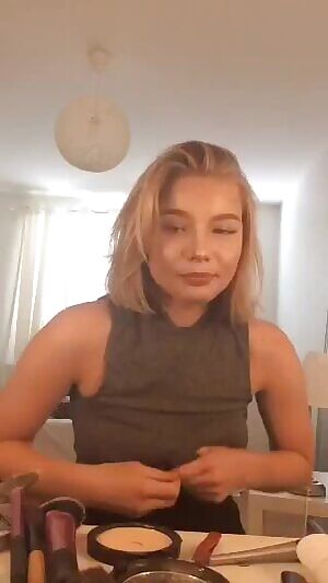 Drunk girl at the table straightens the shirt