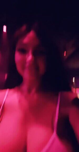 Groping her friend's tits