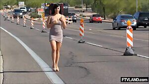 Down the busy Highway taking her dress off