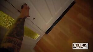 Revealing her big natural tits in front of the door