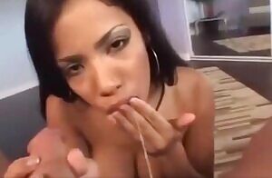 Dousing her pancakes in syrup