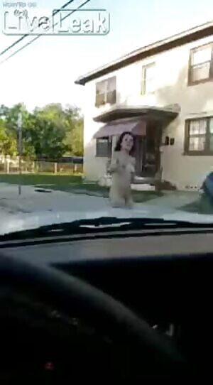 naked girl jumps on man's car