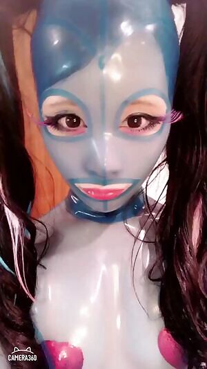 Kitami in a clear rubber suit