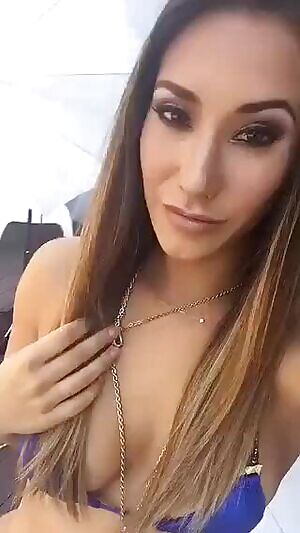 Teasing in blue bikini