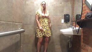 MILF Uses Vibrator In Bar Restroom
