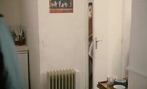 A young Marion Cotillard doing a very poor job of covering her boobs