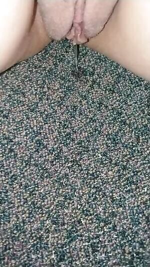 close up pissing into the carpet