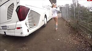 Bunny pissing behind a bus