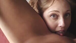 Pretty eyes licking her gf pussy passionately