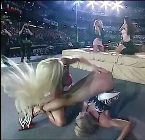 Torrie Wilson spanks Stacy Keibler